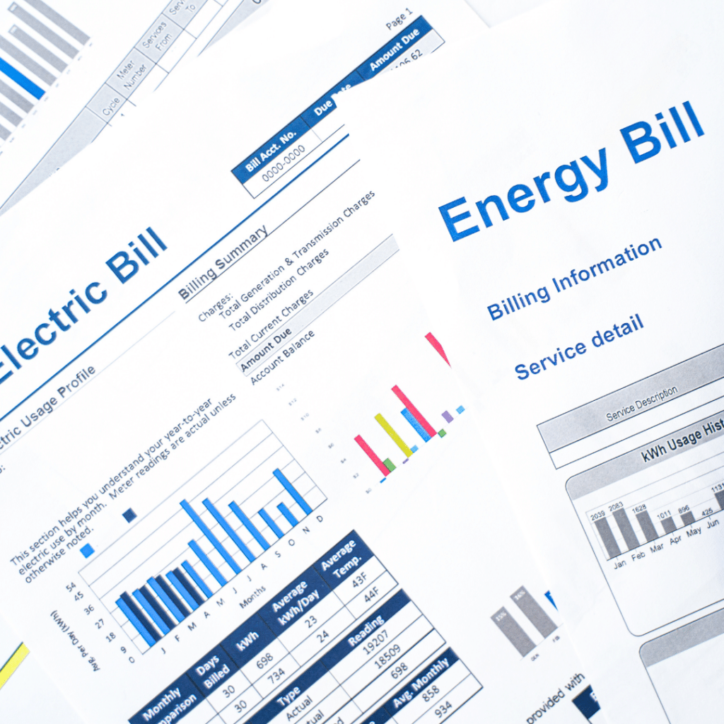 Close-up of a stack of utility bills for an audit to save on energy bills.